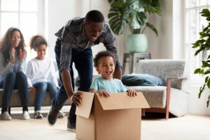 Happy family moving into a new home with a positive attitude