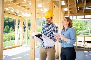 woman and builder making decisions about new construction. home